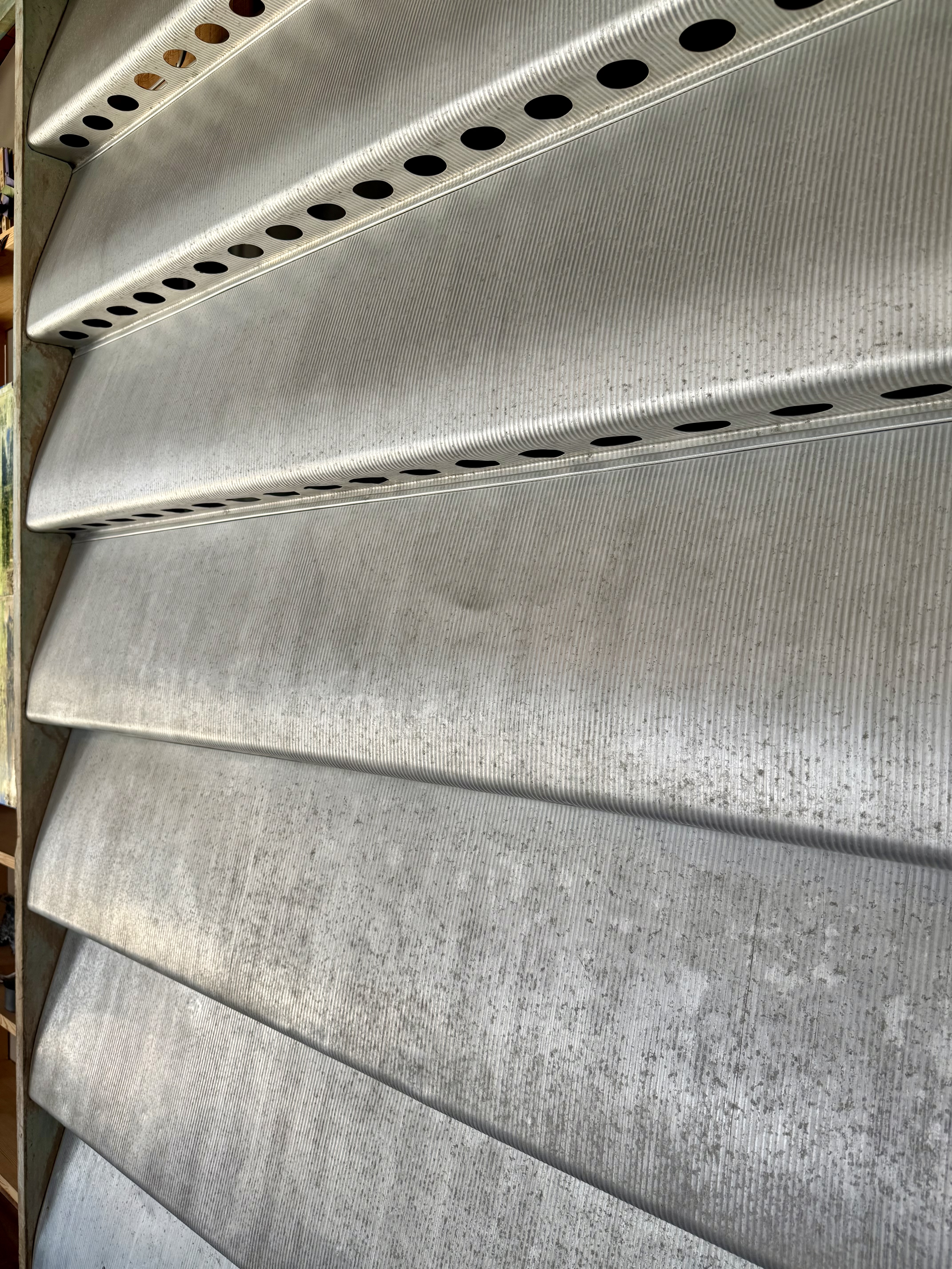 Corrugated pressed aluminium texture — Jean Prouvé industrial fabrication